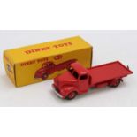 A Dinky Toys No. 422 Fordson Thames flat truck comprising of all red body and matching hubs,