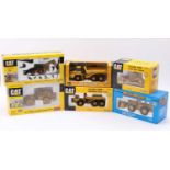 An ERTL Caterpillar related mixed scale diecast group to include a Mighty Movers Caterpillar 988B