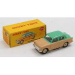A Dinky Toys No. 175 Hillman Minx saloon comprising of beige lower body with green upper, complete