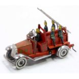 George Fischer Germany tinplate and clockwork Fire Engine comprising a red printed body, with