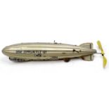 Tipp & Co of Germany tinplate Graf Zeppelin DLZ 127 Airship, comprising a gold lithographed body,