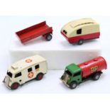 A small collection of Triang Minic tinplate clockwork models comprising an Ambulance, a BP Petrol