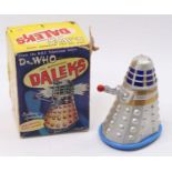 A Marx battery-operated Dalek from the BBC Television Series "Dr Who", silver plastic body with a