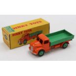 A Dinky Toys No. 414/30M rear tipping wagon comprising of orange cab and chassis with green back and