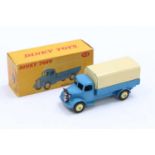 A Dinky Toys No. 413 Austin covered wagon comprising of blue cab and chassis, with cream back and