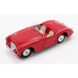 Corgi Toys, 300, Austin Healey, red body with cream interior, rare spun shaped hubs, with original