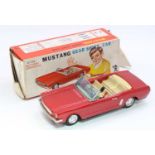 A Bandai of Japan tinplate battery-driven No. 4104 Ford Mustang Gear Shift Car comprising a metallic