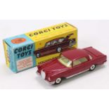 Corgi Toys No. 230 Mercedes Benz 220 SE coupe comprising maroon body with yellow interior and spun