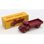A Dinky Toys No. 412 Austin wagon comprising of maroon cab and chassis with red Supertoys hubs,