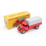 A Dinky Toys No. 413 Austin covered wagon comprising of red cab and chassis, with grey back and