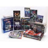 A collection of Doctor Who books, DVDs cassette tapes and video cassettes including the Doctor Who