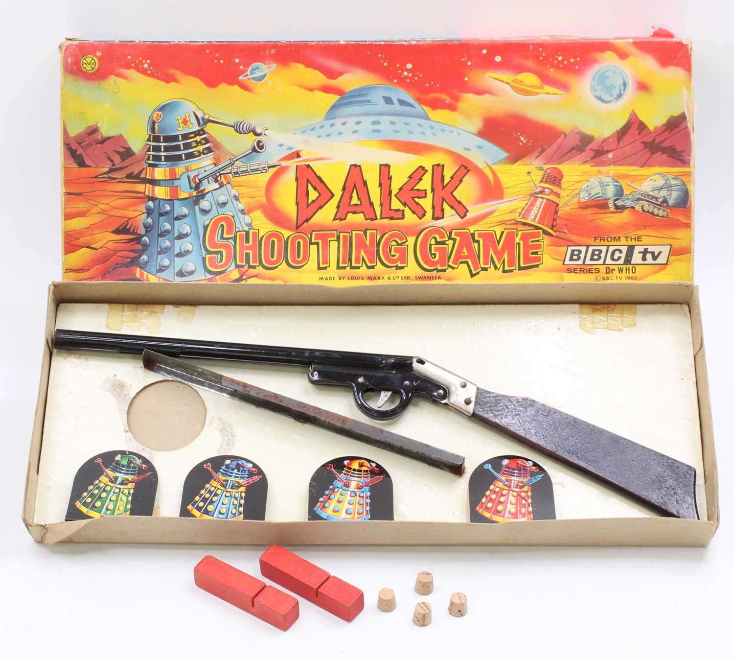 A Louis and Marx Toys Doctor Who Dalek shooting game copyright 1965. Set includes a cork gun, four - Image 2 of 6