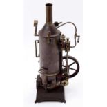 A George Carette vertical live steam boiler, comprising of cast iron base with original burner,