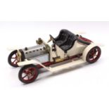 A Mamod SA1 steam roadster of usual specification comprising of white body with red spoked hubs,