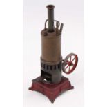 A Bing style or similar vertical spirit fired steam engine comprising of red painted cast metal base