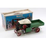 A Mamod SW1 boxed live steam wagon comprising green and white body, includes original printed box