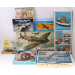 A small selection of mixed model kits, with examples including an Airfix 1/24th scale Spitfire 1a, a