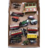 A tray containing a mixed collection of O Gauge Locomotives and Wagons, with examples including a