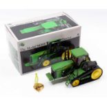 An ERTL No. 15286 1/32 scale diecast model of a John Deere model 9420T tractor housed in the