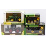 A collection of Universal Hobbies and Britains 1/32 and 1/16 scale boxed model tractors, four