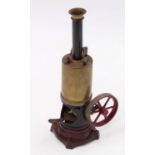A Bing vertical spirit fired steam engine comprising of cast iron maroon painted and stepped base