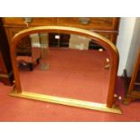 A contemporary giltwood bevelled arched overmantel mirror in the Victorian taste, 78 x 123cm