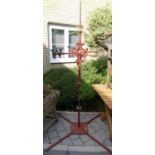 A painted wrought iron weather vane, missing the letter 'S', height 207cm