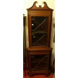 An Edwardian mahogany and satinwood inlaid freestanding corner cabinet, having two astragal glazed
