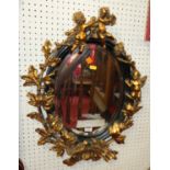A contemporary moulded composite and gilt decorated oval wall mirror in the French taste,