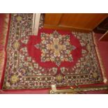 A Persian woollen red ground Tabriz rug, 158 x 130cm