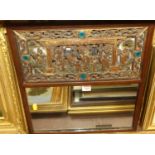 A Chinese fret carved hard wood wall mirror, 46x44cm