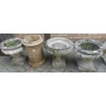 A pair of reconstituted stone squat pedestal garden planters; together with a single garden