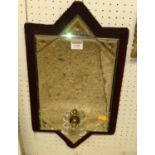 An early 20th century velvet clad wall mirror, with engraved outer detail, fitted with twin candle