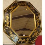 A contemporary black and floral gilt decorated octagonal wall mirror, 89 x 74cm