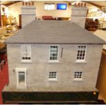 A very large home made two-storey dolls house titled Creffield House of South Street, Manningtree