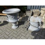 A grey painted cast iron twin handled pedestal garden urn, in the classical taste with gadrooned