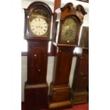 A 19th century mahogany longcase clock, having an arched brass and silvered dial, twin winding holes