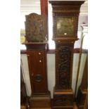 A relief carved oak longcase clock, having a brass square dial, with pendulum; together with a