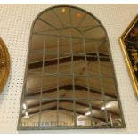 A contemporary metal framed arched wall mirror, in the form of a window, 78 x 50cm