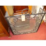 An early 20th century wrought iron and mesh inset triptych sparkguard