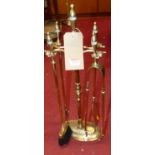 Sundry turned brass fire tools on stand (5) height of stand 65cm