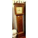 A circa 1800 provincial oak longcase clock, having a painted square dial signed John Wood