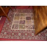 A Persian style red ground machine-woven rug, European manufactured, 193 x 133cm