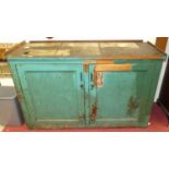 A late Victorian and later painted pitch pine double door workman's cupboard, w.157cm With some