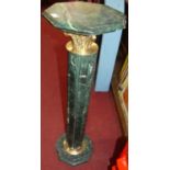 A pair of contemporary verdigris marble octagonal sculpture stands, each raised on reeded columns,