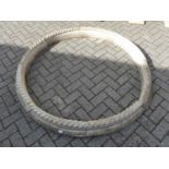 A set of eight reconstituted stone rope twist curved edging strips, comprising a circle, each length