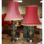 A pair of Chinese brass table lamps, relief decorated with flowers, h.50cm (excluding fittings)