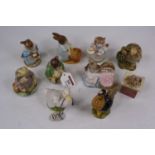 A collection of Royal Albert Beatrix Potter figures to include Jeremy Fisher, and Samuel Whiskers,