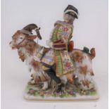 A 19th century German porcelain model of Count Von Bruhl's tailor, shown riding a goat, height