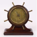 A 20th century mahogany aneroid barometer, in the form of a ships wheel, h.19cm
